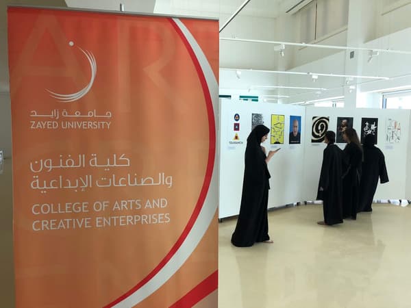 woman looking at posters