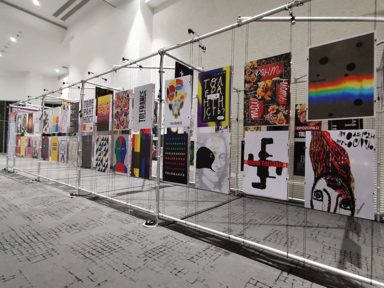 posters on metal grid