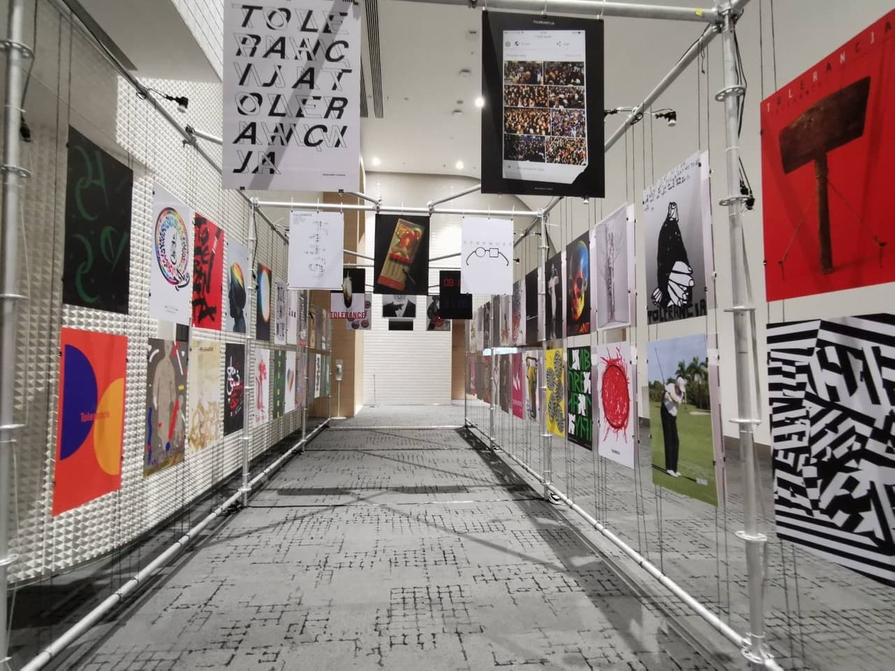 posters on metal grid