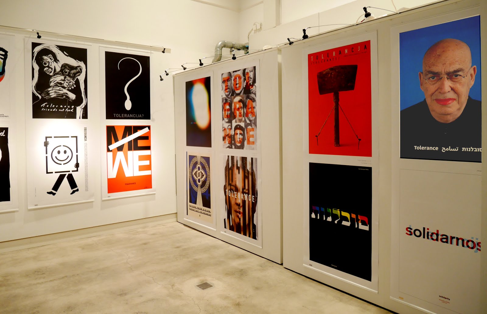 Posters in a white gallery space
